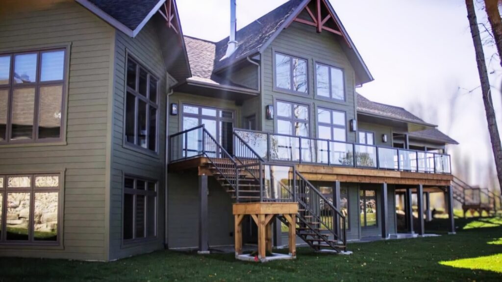 A home in Warren, Ontario, featuring new energy-efficient windows, a stylish entry door, and durable vinyl siding installed by Quality Contracting.